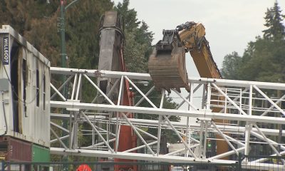 A collapsed crane is seen across W 41st Avenue in Vancouver