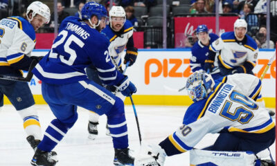 St. Louis Blues goaltender Jordan Binnington stops Toronto Maple Leafs defenceman Conor Timmins