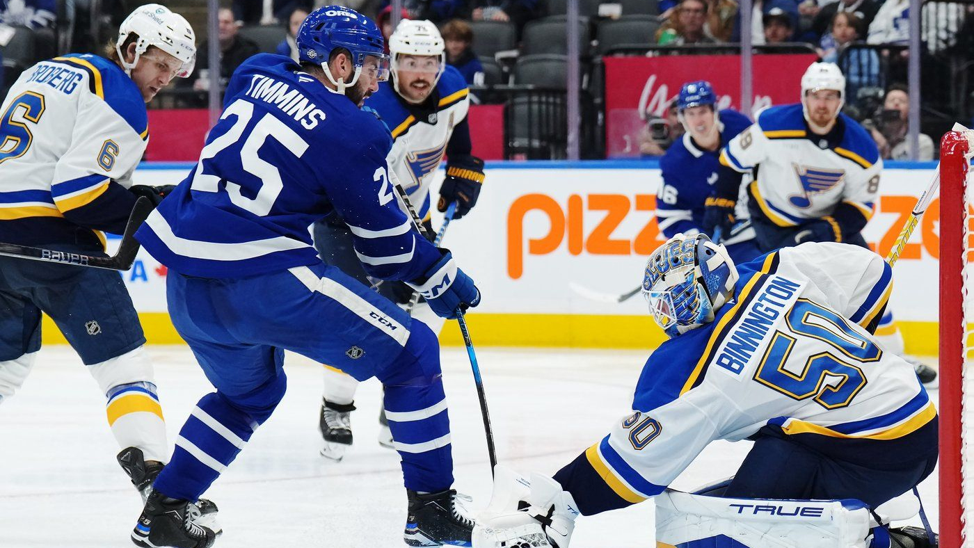 St. Louis Blues goaltender Jordan Binnington stops Toronto Maple Leafs defenceman Conor Timmins