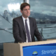 David Eby speaking at a podium