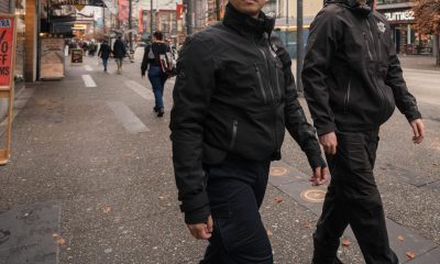 Two DVBIA safety ambassadors walk downtown in Vancouver