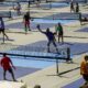 People practice pickleball on the courts of CityPickle at Central Park's Wollman Rink,