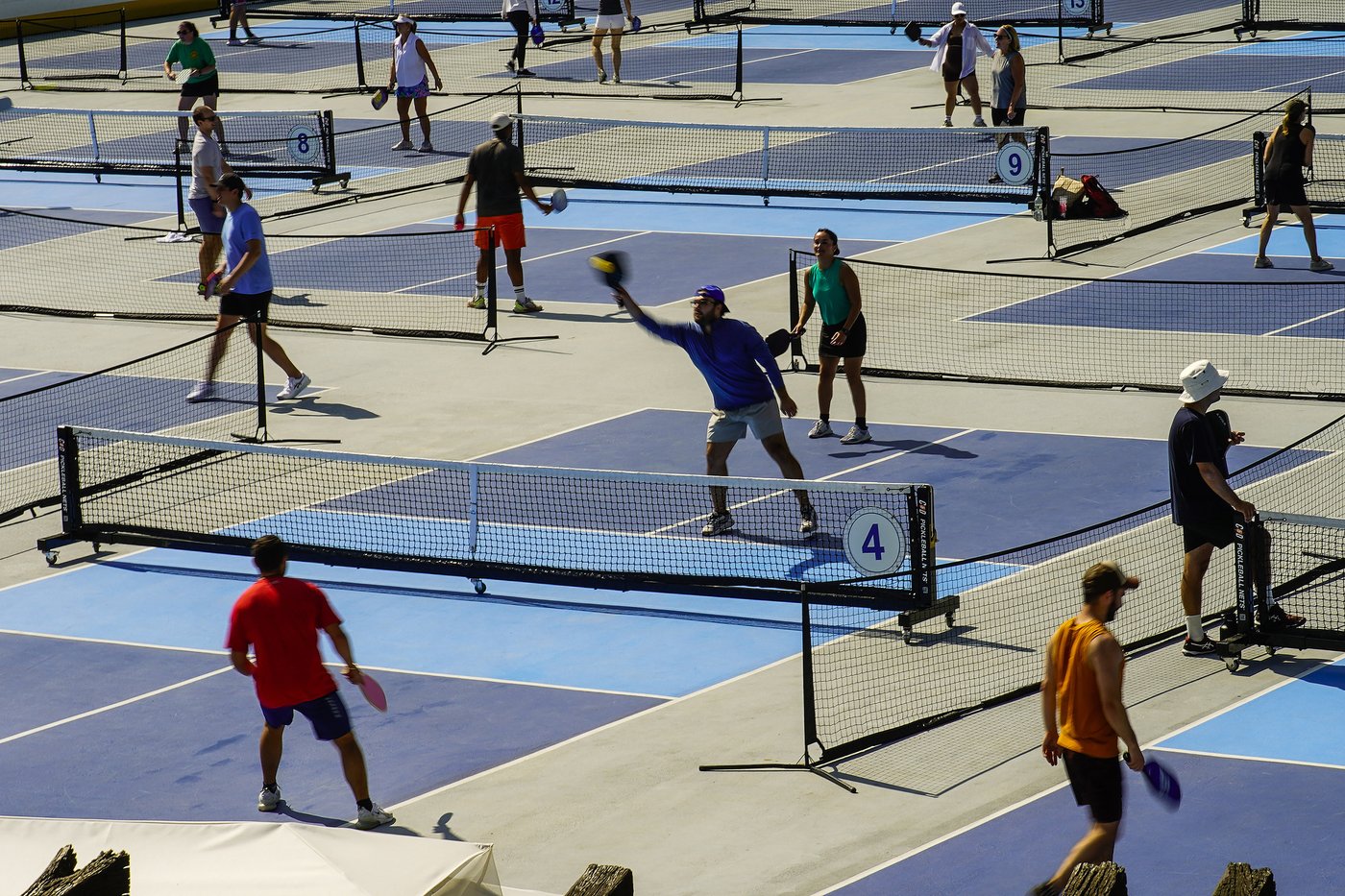 People practice pickleball on the courts of CityPickle at Central Park's Wollman Rink,