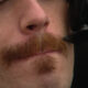 A close up of a Movember moustache that is being tended to