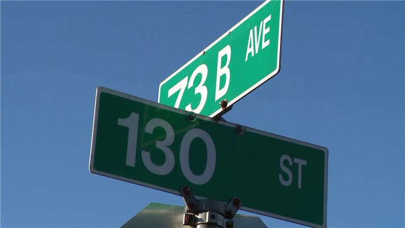 Street signs at the corner of 73 B Avenue and 130 Street