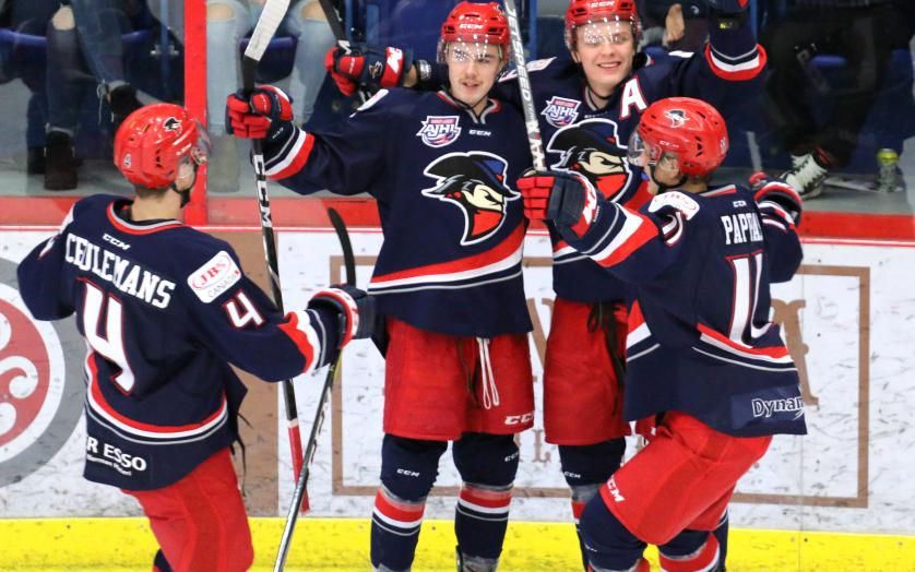 FILE - Players with the Brooks Bandits celebrate a goal during regular season play