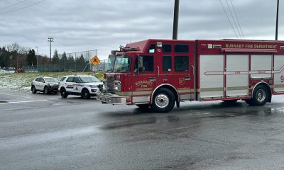 Emergency vehicles block the entrance to the Parkland refinery in Burnaby near Confederation Park after a fire at the refinery cloaked Vancouver in a foul odour.