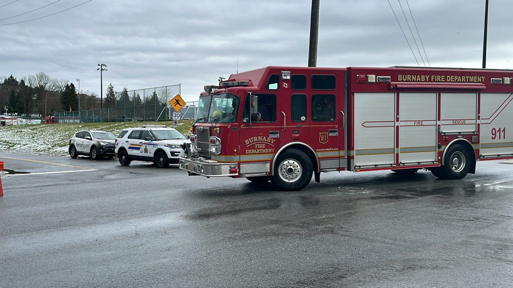 Emergency vehicles block the entrance to the Parkland refinery in Burnaby near Confederation Park after a fire at the refinery cloaked Vancouver in a foul odour.