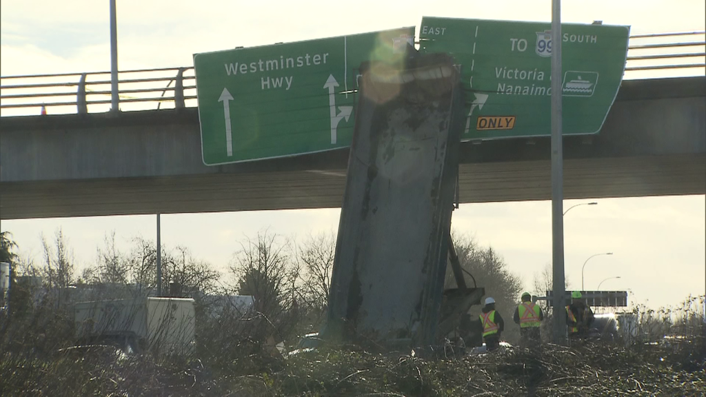 A truck strikes the Cambie Road overpass above Knight Street in Richmond, B.C.