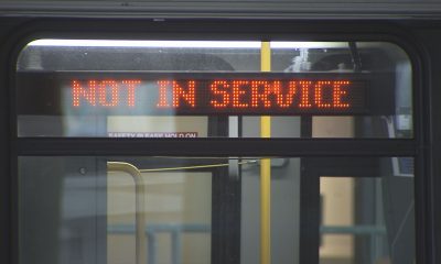 A bus is seen with a 'Not In Service' sign in Metro Vancouver