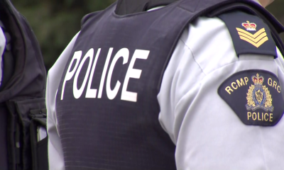 The word POLICE on the back of a Surrey RCMP officer's vest