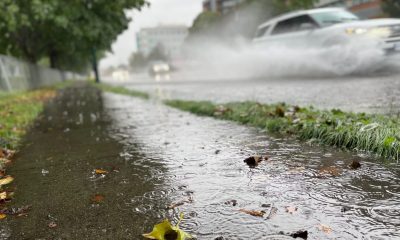 A car splashes water as it speeds by in Vancouver