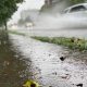 A car splashes water as it speeds by in Vancouver