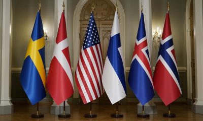 FILE - The Nordic and U.S. flags stand before President Joe Biden poses for a photo with Nordic leaders. Flags from left are Sweden, Denmark, US, Finland, Iceland and Norway, in Helsinki, Finland, July 13, 2023