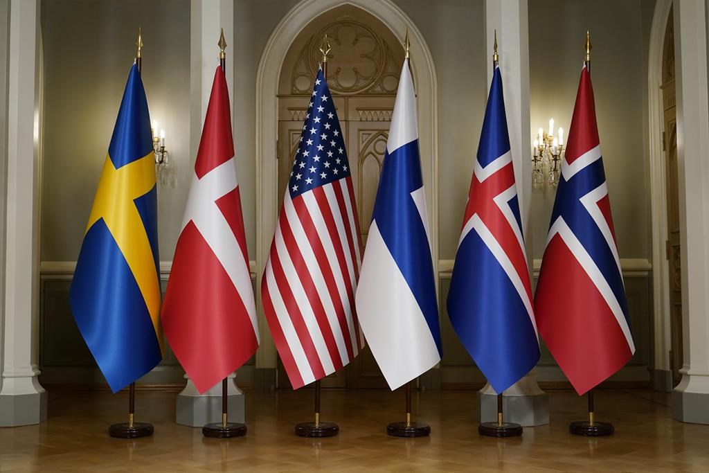 FILE - The Nordic and U.S. flags stand before President Joe Biden poses for a photo with Nordic leaders. Flags from left are Sweden, Denmark, US, Finland, Iceland and Norway, in Helsinki, Finland, July 13, 2023