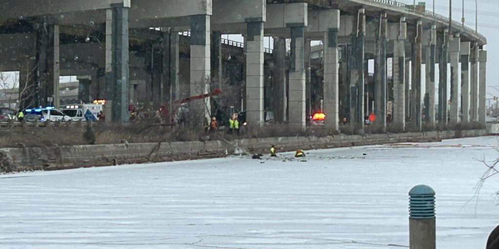 Crews attempt a rescue after a vehicle was submerged in the Keating Channel on January 20, 2024.