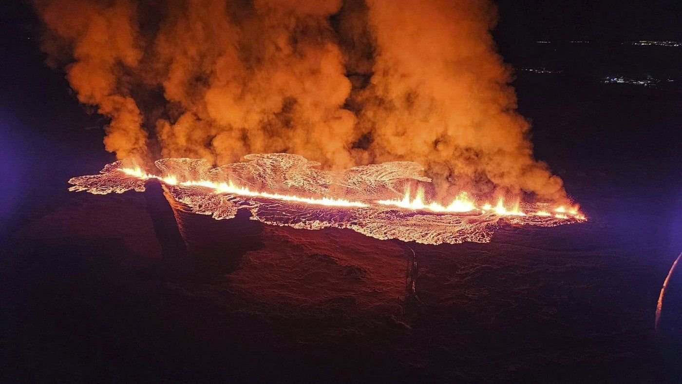 In this photo provided by Civil Protection taken from the Coast Guard's helicopter, a view of lava as the volcano erupts near Grindavík, Iceland, Sunday, Jan. 14. 2024