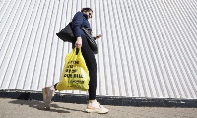 A person leaves a Toronto supermarket with groceries on Oct. 5, 2022