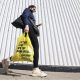 A person leaves a Toronto supermarket with groceries on Oct. 5, 2022