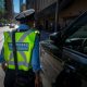 A parking enforcement officer is seen in downtown Toronto.