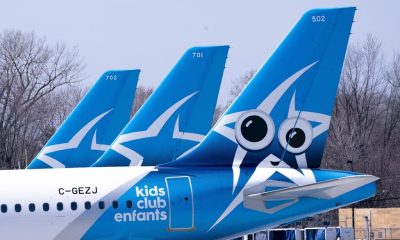 Air Transat aircrafts are seen on the tarmac at Montreal-Trudeau International Airport in Montreal, on Wednesday, April 8, 2020. THE CANADIAN PRESS/Paul Chiasson