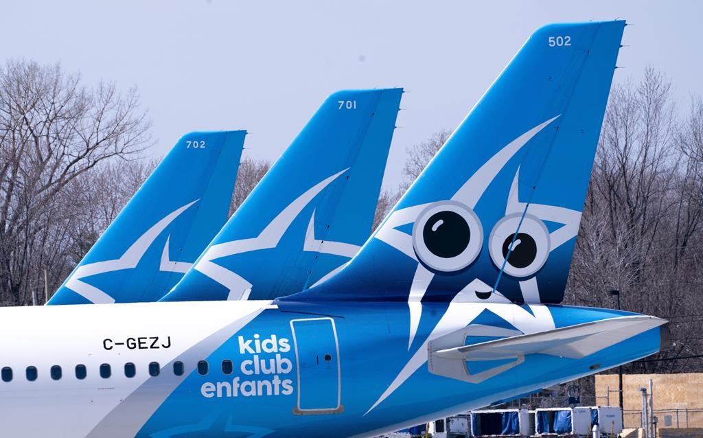 Air Transat aircrafts are seen on the tarmac at Montreal-Trudeau International Airport in Montreal, on Wednesday, April 8, 2020. THE CANADIAN PRESS/Paul Chiasson