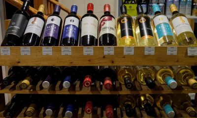 Bottles of British Columbia wine on display at a liquor store in Cremona, Alta., Wednesday, Feb. 7, 2018. An interprovincial wine war is fermenting after Alberta's provincial liquor wholesaler told vintners in British Columbia that it won't stock their products in retail stores unless they stop shipping it directly to consumers