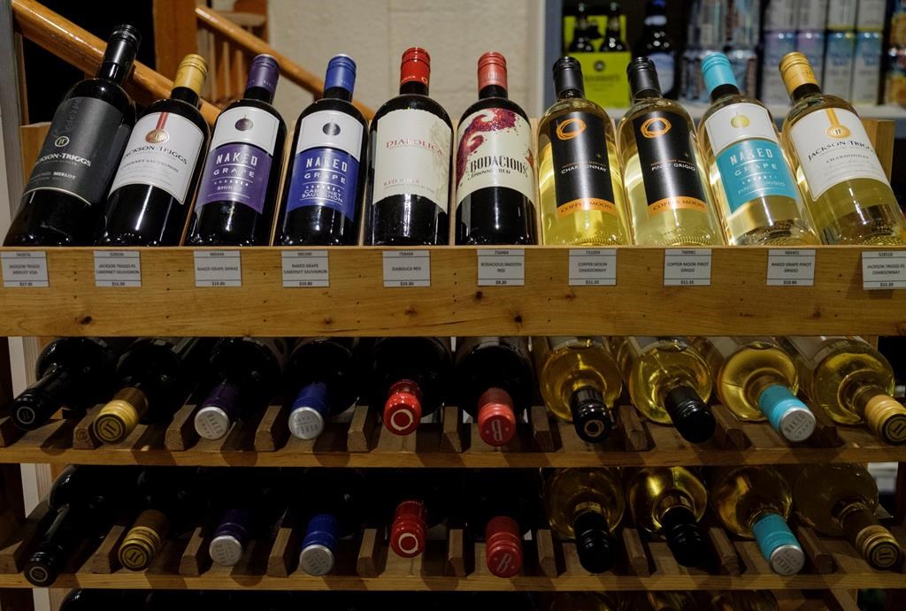 Bottles of British Columbia wine on display at a liquor store in Cremona, Alta., Wednesday, Feb. 7, 2018. An interprovincial wine war is fermenting after Alberta's provincial liquor wholesaler told vintners in British Columbia that it won't stock their products in retail stores unless they stop shipping it directly to consumers