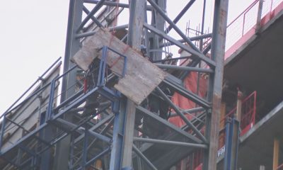 First responders and construction workers at Oakridge Mall in Vancouver on Feb. 21, 2024, after a crane incident at a construction site.