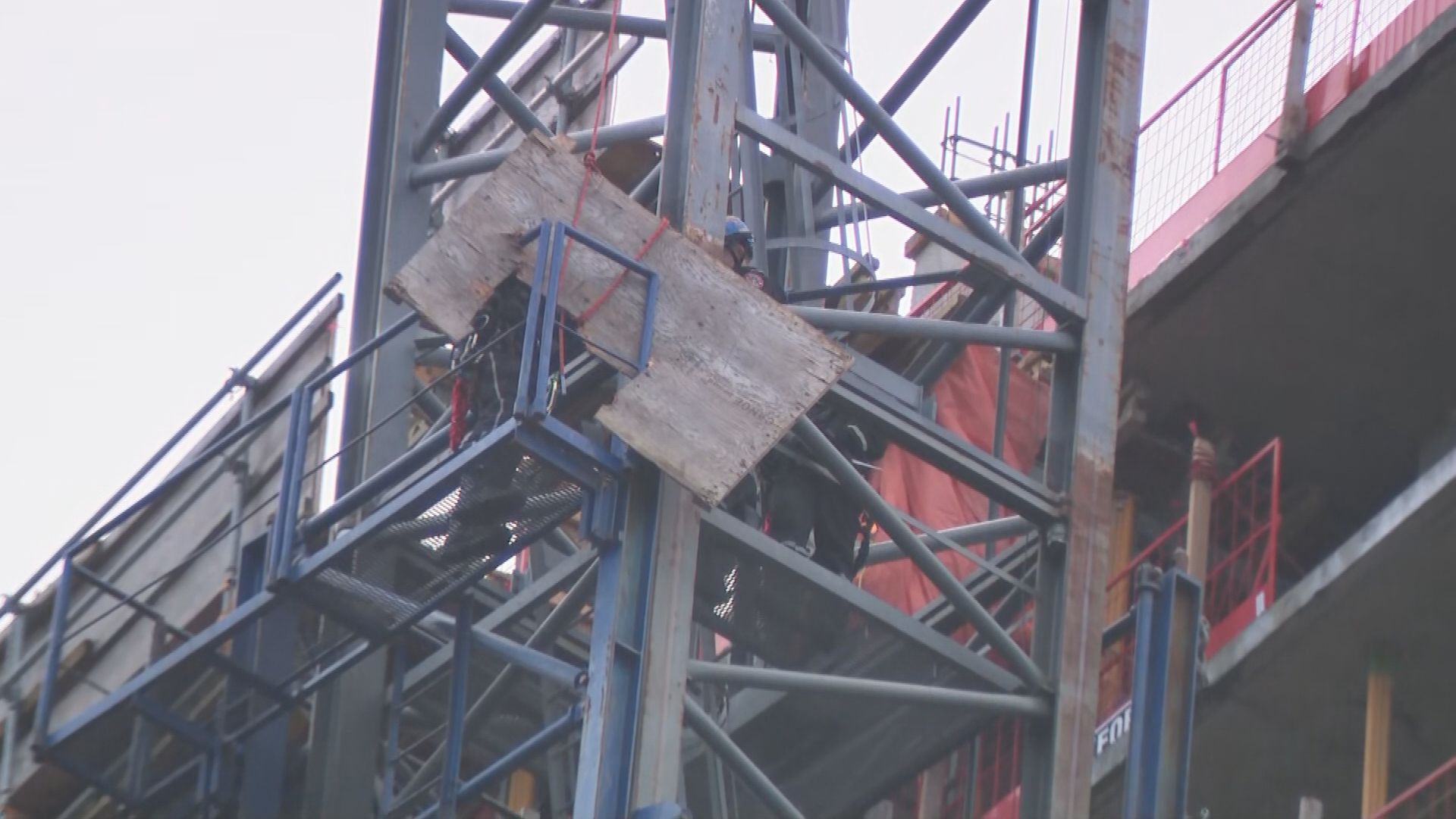 First responders and construction workers at Oakridge Mall in Vancouver on Feb. 21, 2024, after a crane incident at a construction site.