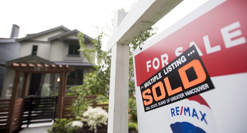 A real estate sign is pictured in Vancouver, B.C., Tuesday, June, 12, 2018.