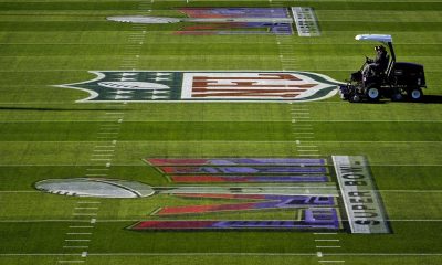 Grounds crew prepare the field outside Allegiant Stadium ahead of the NFL Super Bowl 58 football game, early Saturday, Feb. 3, 2024, in Las Vegas.