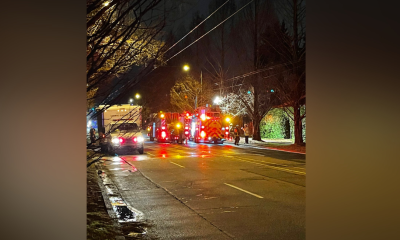 Crews attend a fire at a home on Arbutus Street near East 33rd Avenue Friday evening.