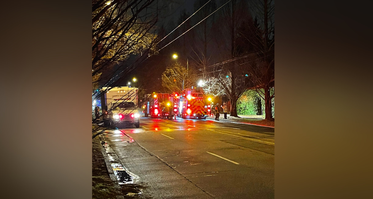 Crews attend a fire at a home on Arbutus Street near East 33rd Avenue Friday evening.