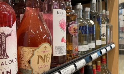 a row of alcohol at a liquor store.