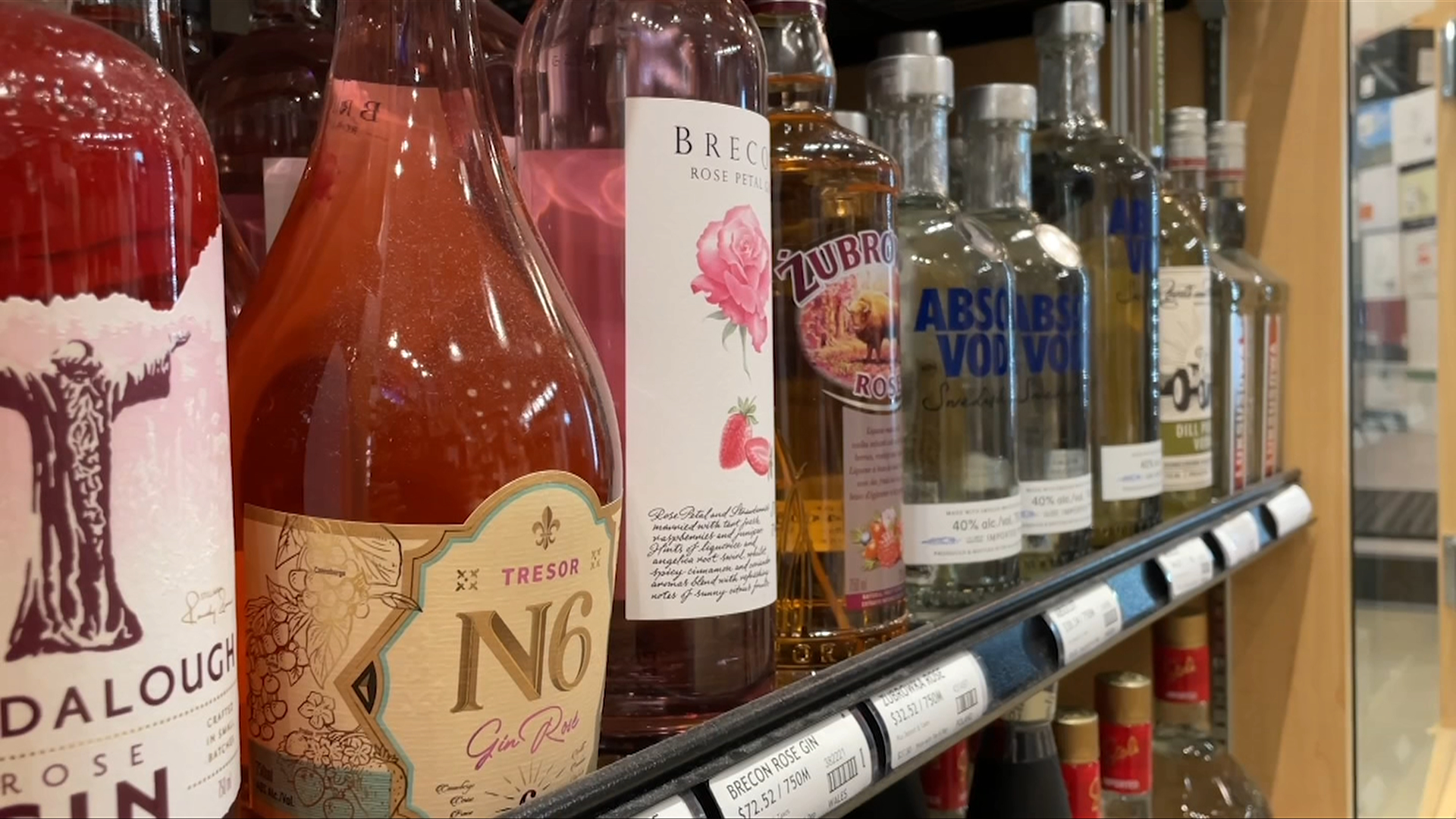 a row of alcohol at a liquor store.