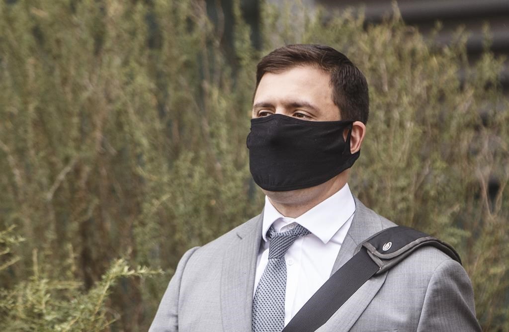 Matthew McKnight walks out of court during a break in Edmonton on Wednesday, July 8, 2020. THE CANADIAN PRESS/Jason Franson