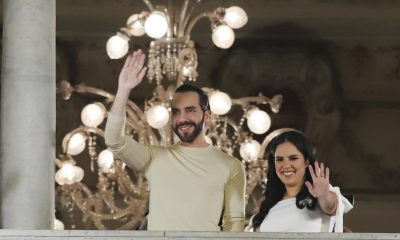 El Salvador President Nayib Bukele, left, accompanied by his wife Gabriela Rodriguez, wave to supporters from the balcony of the presidential palace in San Salvador, El Salvador, after polls closed for general elections on Sunday, Feb. 4, 2024. El Salvador President Bukele and his New Ideas party have won the supermajority the leader needs in Congress to govern as he pleases, electoral officials announced Monday, Feb. 19