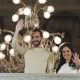 El Salvador President Nayib Bukele, left, accompanied by his wife Gabriela Rodriguez, wave to supporters from the balcony of the presidential palace in San Salvador, El Salvador, after polls closed for general elections on Sunday, Feb. 4, 2024. El Salvador President Bukele and his New Ideas party have won the supermajority the leader needs in Congress to govern as he pleases, electoral officials announced Monday, Feb. 19