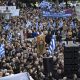 Protesters gather during a rally against same-sex marriage, at central Syntagma square, in Athens, Greece, Sunday, Feb. 11, 2024.