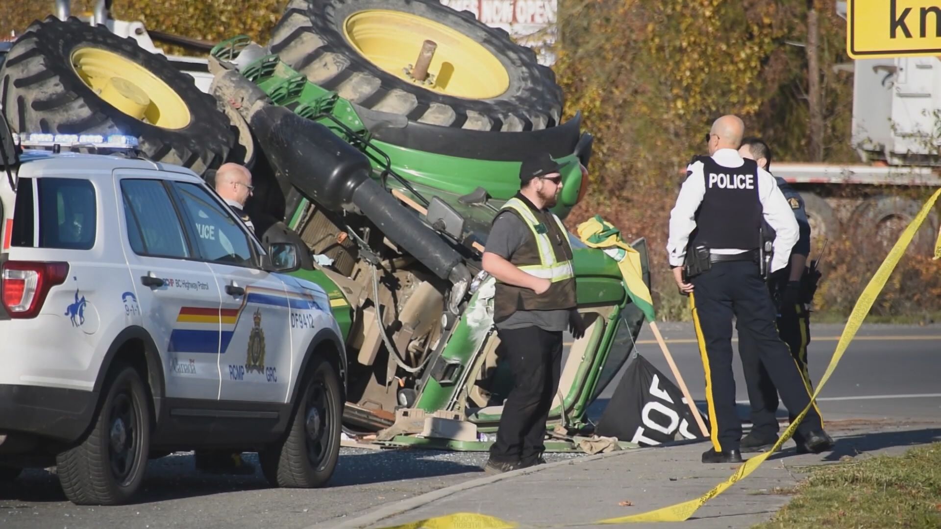 A tractor travelling on Highway 1 hit a police cruiser on Nov. 25, 2023, causing the tractor to roll over, according to Surrey RCMP