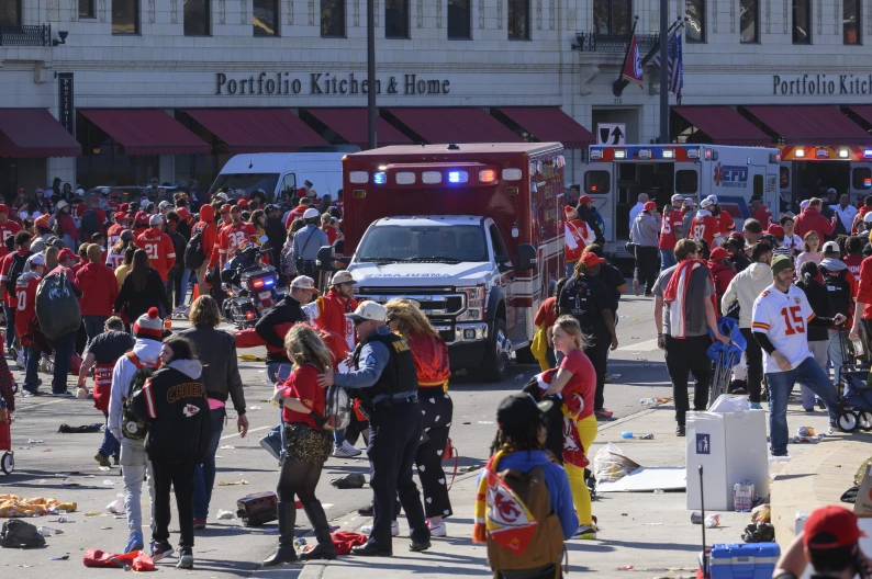 Police clear the area following a shooting at the Kansas City Chiefs NFL football Super Bowl celebration in Kansas City, Mo., Wednesday, Feb. 14, 2024. (AP Photo/Reed Hoffmann)