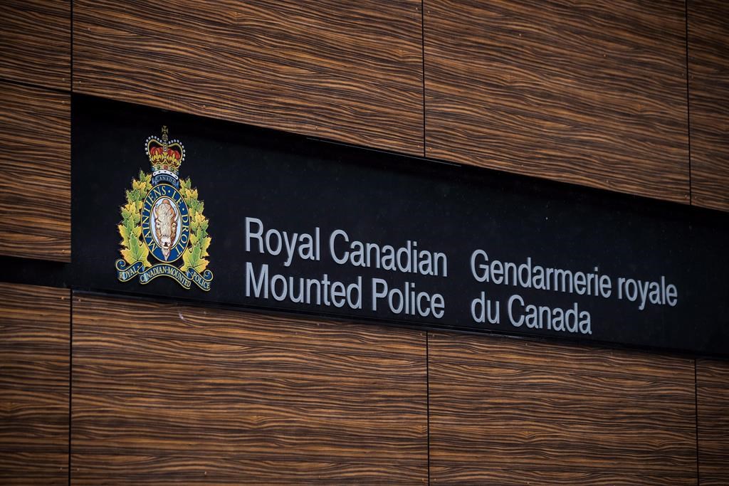 The RCMP logo is seen outside Royal Canadian Mounted Police "E" Division Headquarters, in Surrey, B.C., on Friday April 13, 2018. THE CANADIAN PRESS/Darryl Dyck