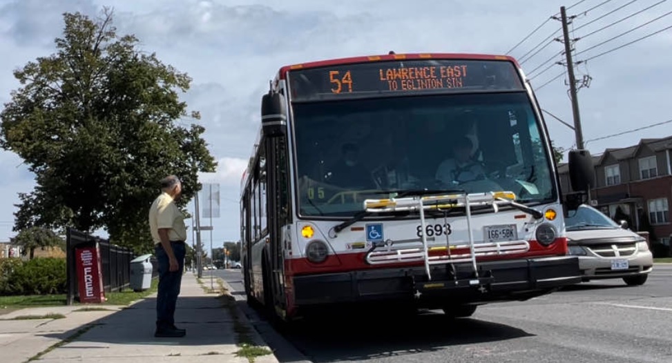 A TTC bus is seen on Lawrence Avenue East.