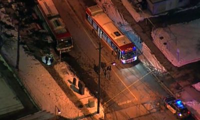 Police tape surrounds a TTC bus on Driftwood Avenue