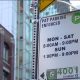 A sign showing paid on-street parking is being enforced