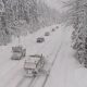 File image of Highway 99 near Whistler covered in snow. Trucks and cars driving through the snow.