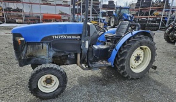 Among the stolen equipment was a blue New Holland tractor - older style.