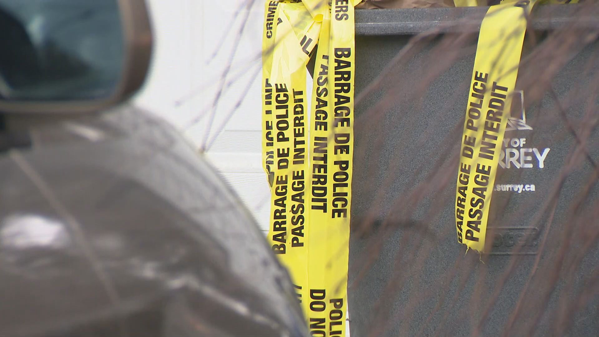 A home and a vehicle can be seen with bullet holes in Surrey