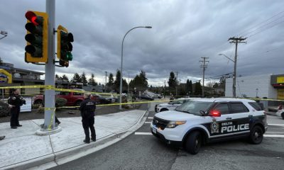 Officers with the Surrey RCMP and Delta Police Department block off a section of Scott Road near 84th Avenue after a daytime shooting left one person hurt on Feb. 2, 2024